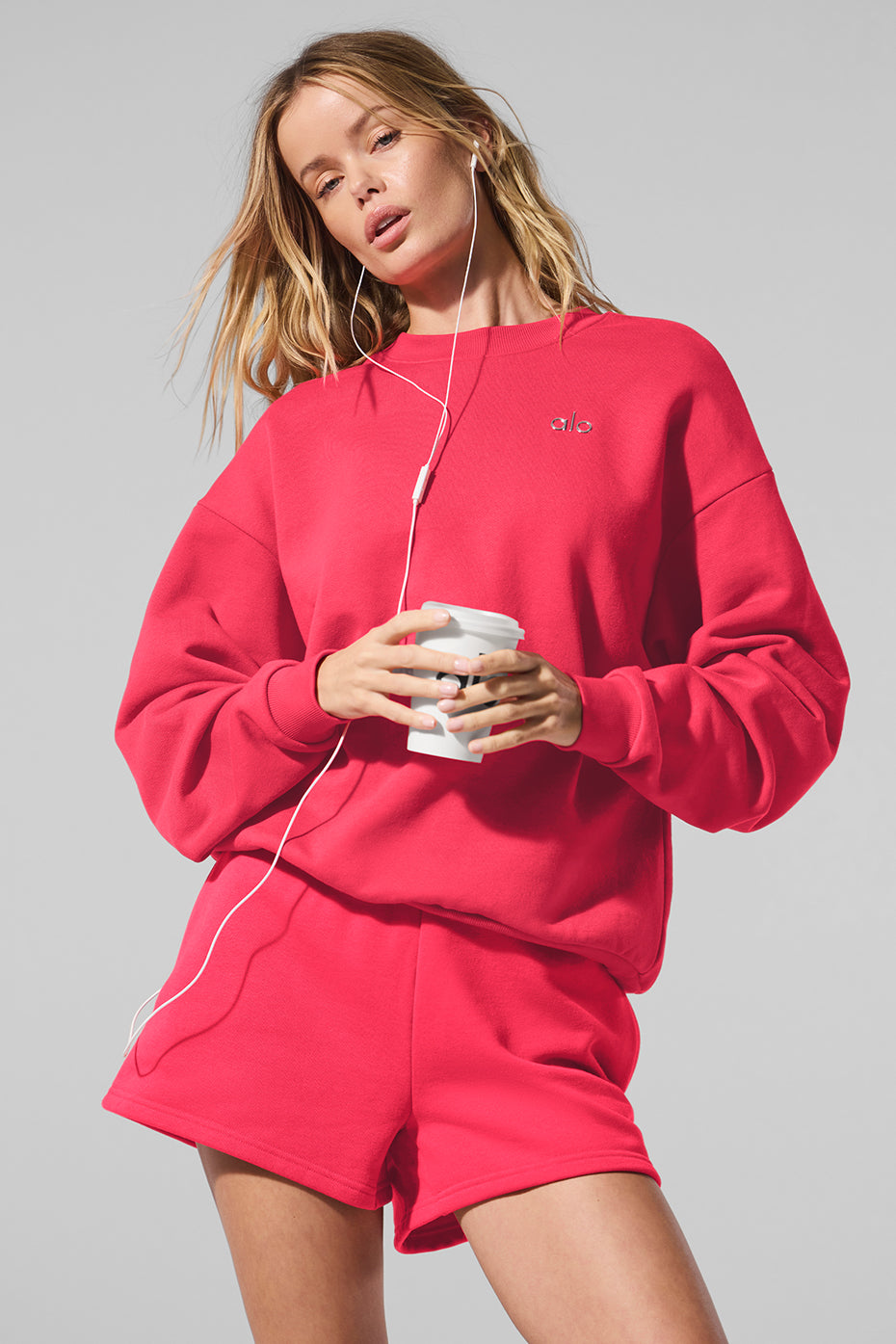 Front view of the cozy black crew neck pullover styled with jeans.