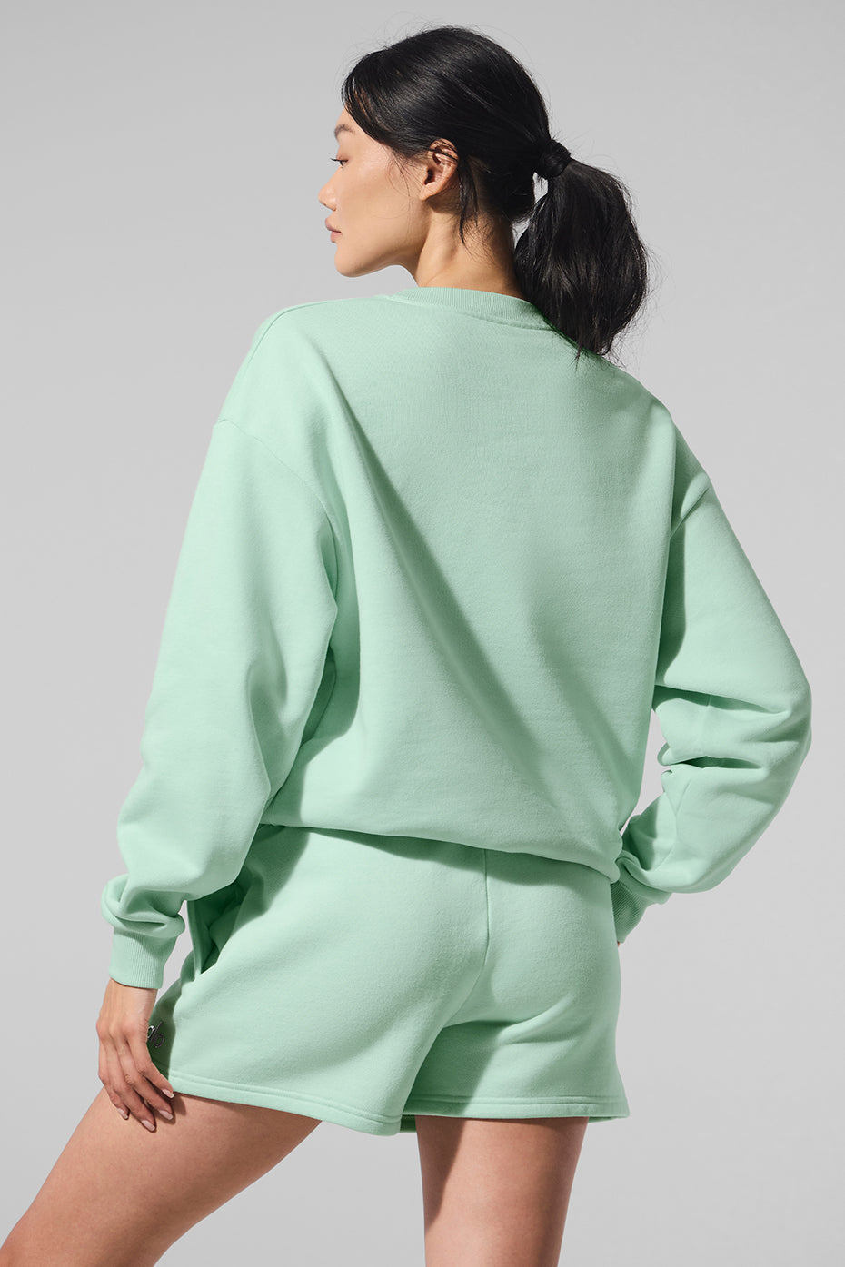 Close-up of ribbed cuffs on womens crewneck sweatshirt.