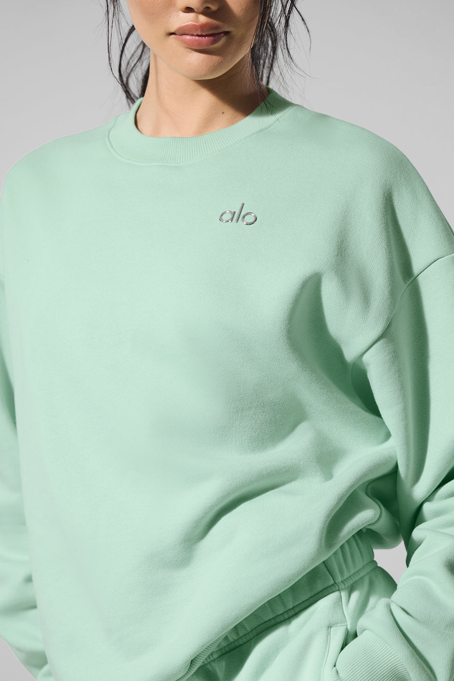 Close-up of ribbed cuffs on womens crewneck sweatshirt.