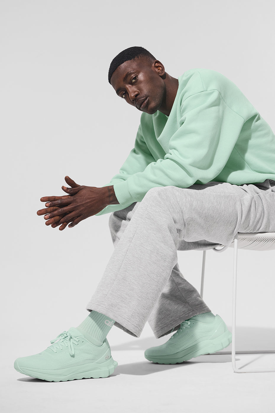 Back view showcasing the relaxed fit of the spearmint pullover.