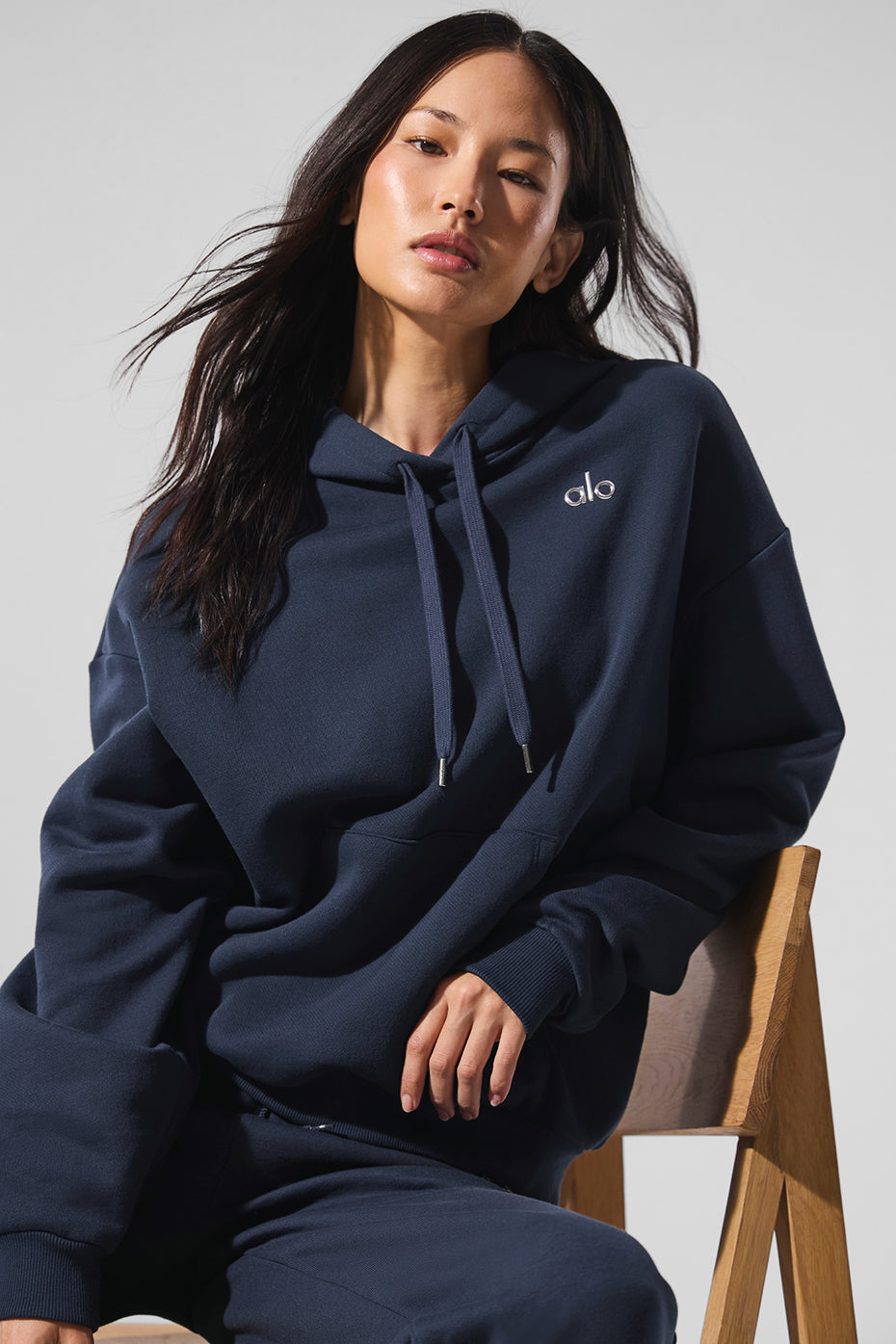 Flat lay of parke sweatshirt showing cuffs, neckline, and pocket detail