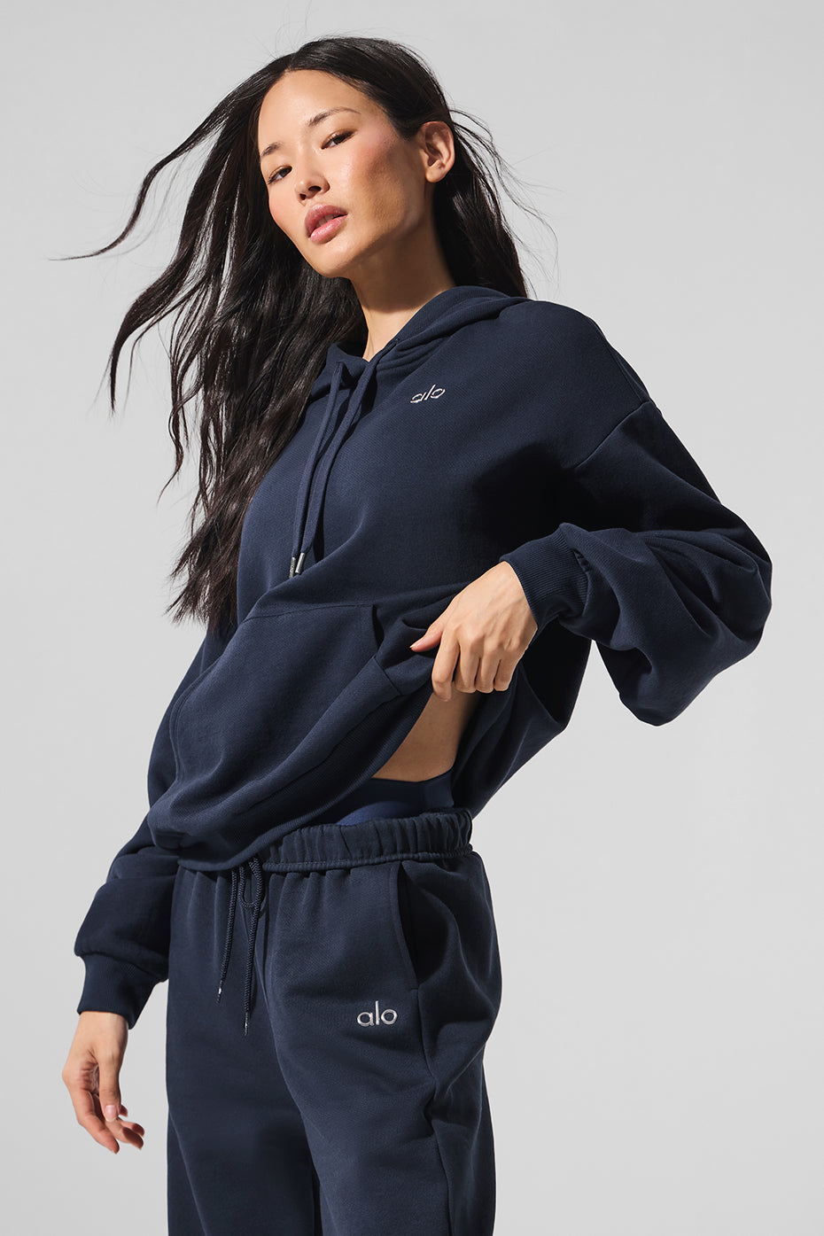 Flat lay of parke sweatshirt showing cuffs, neckline, and pocket detail