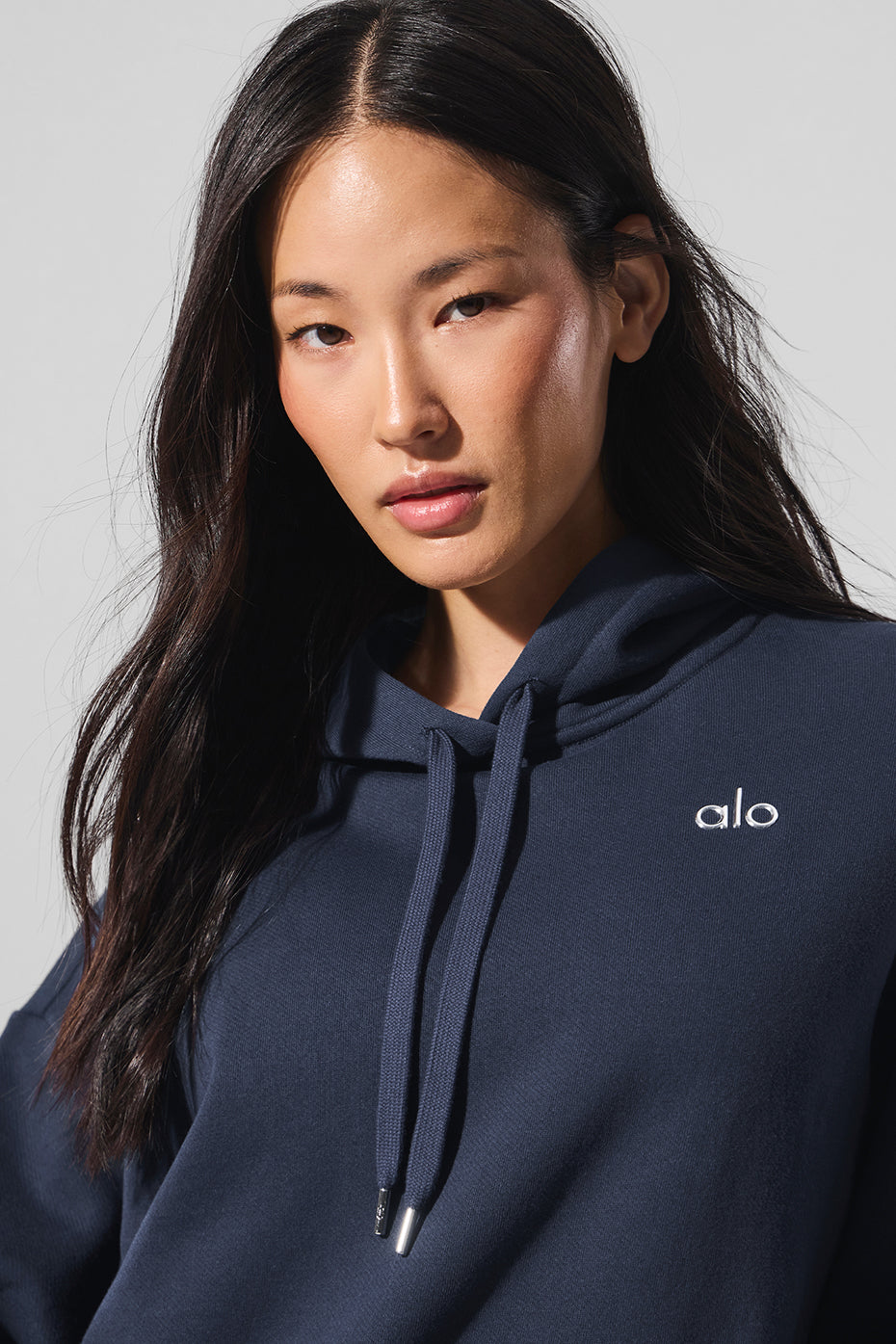 Casual hoodie styled with matching sweatpants in downtown setting