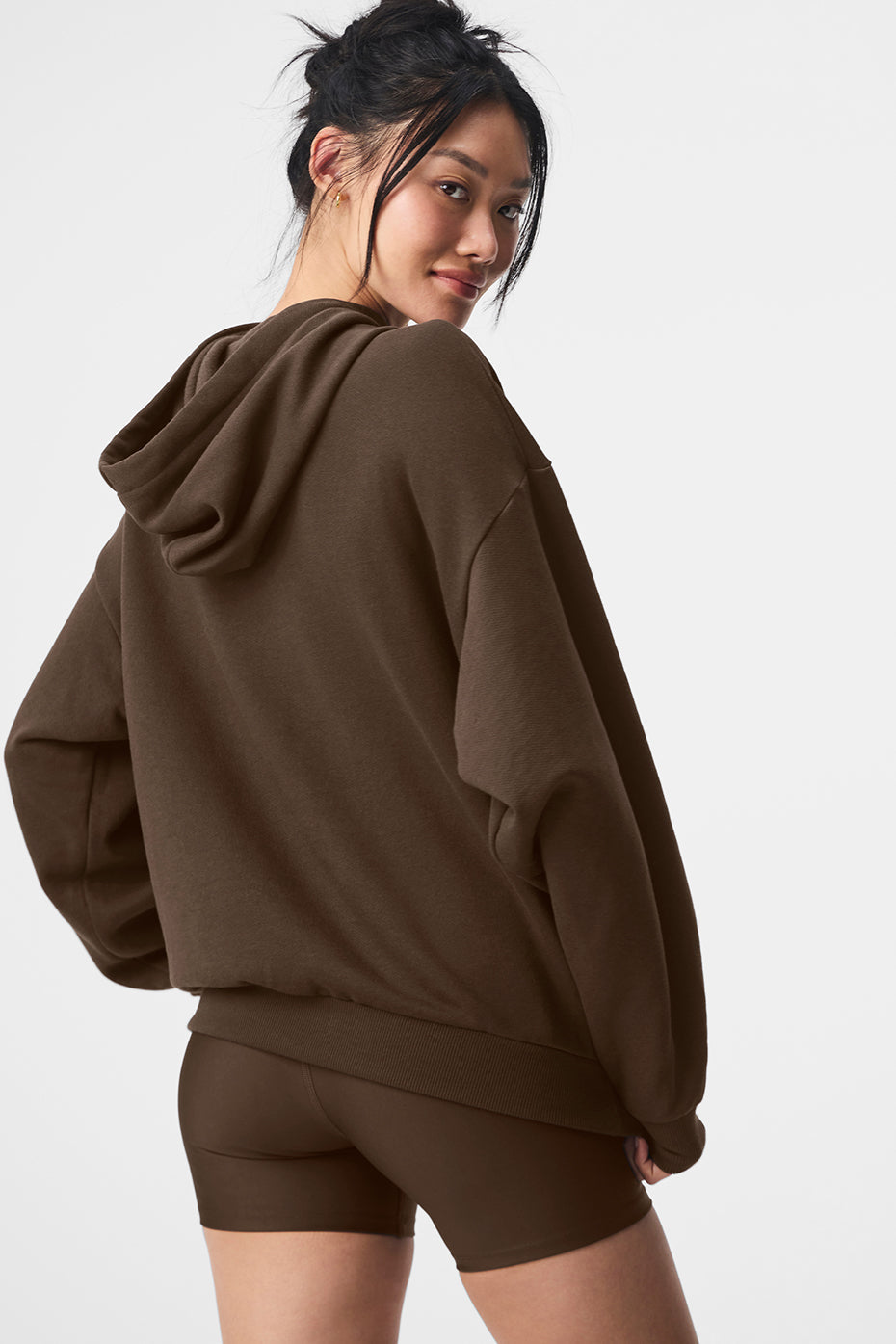 Close-up of the kangaroo pocket and ribbed detailing on the sweatshirt.