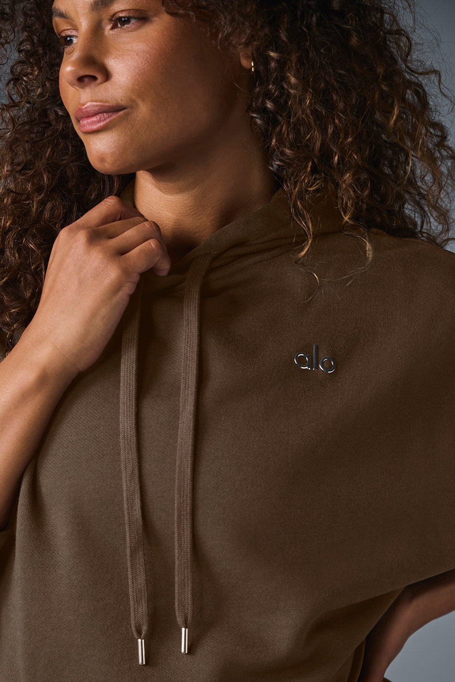 Close-up of the kangaroo pocket and ribbed detailing on the sweatshirt.
