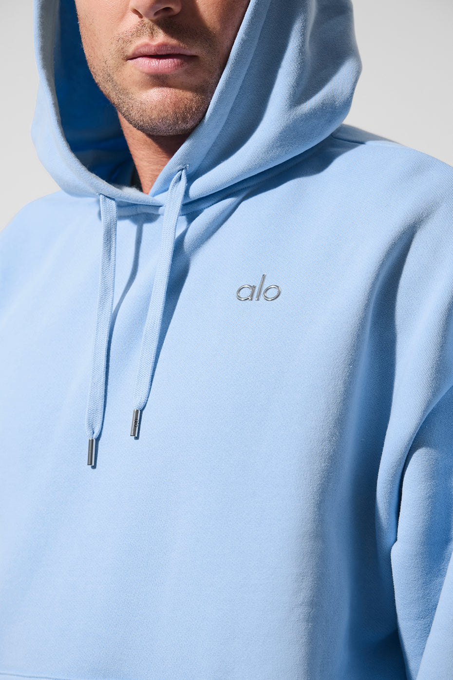 Front and back views of hoodie showing oversized fit