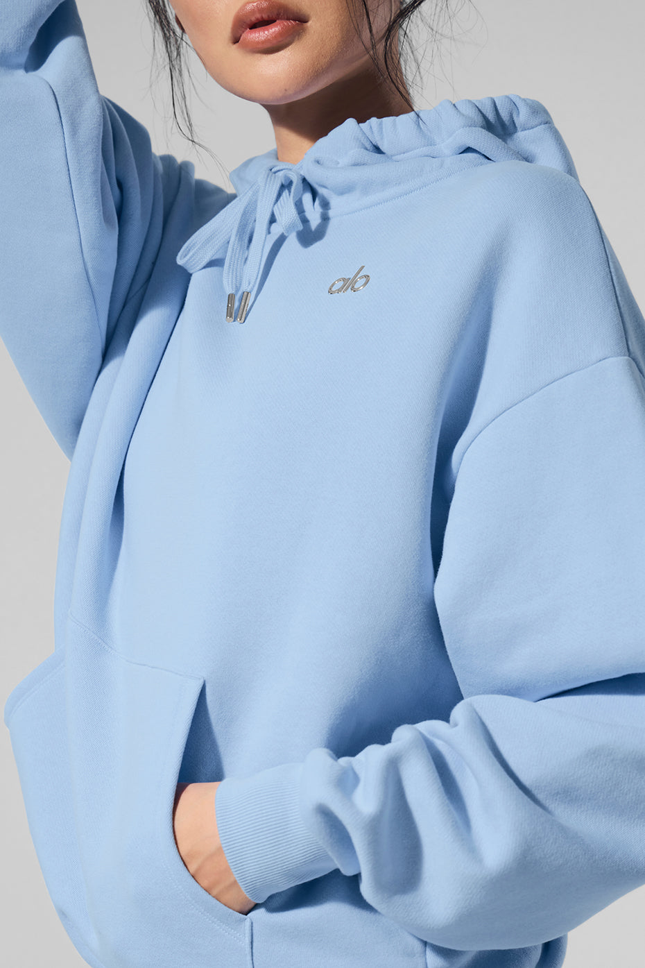 Seashell blue comfort hoodie set on a model in a park.