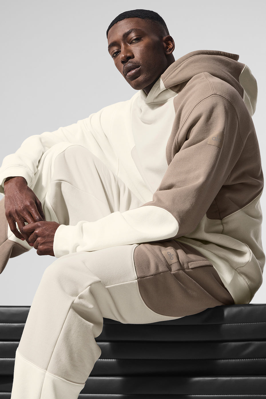 Flat lay of ivory comfort hoodie showing textured wave stitching and crewneck sweatshirt collar