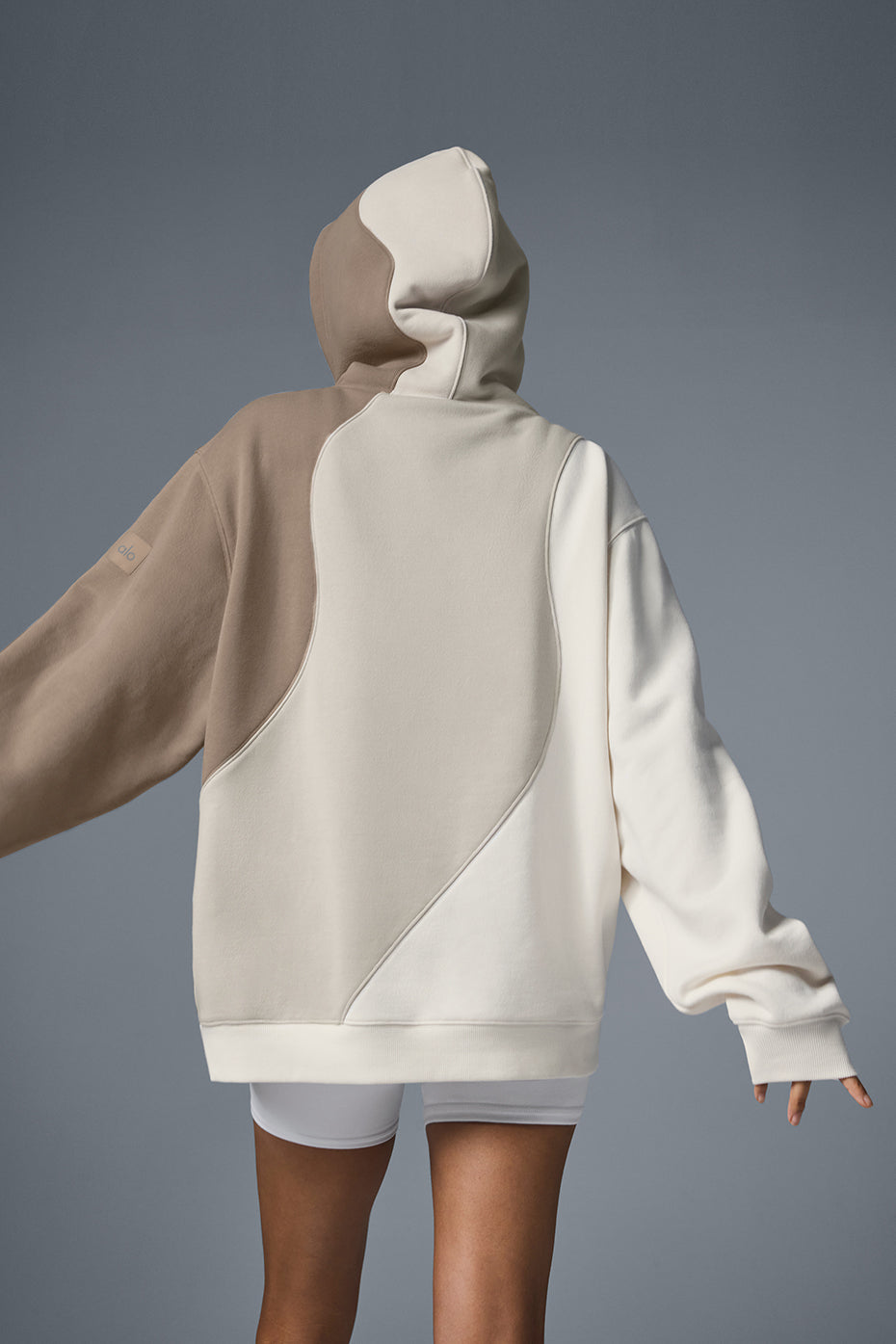 Model wearing the oversized zip up hoodie paired with matching sweatpants for a stylish look.