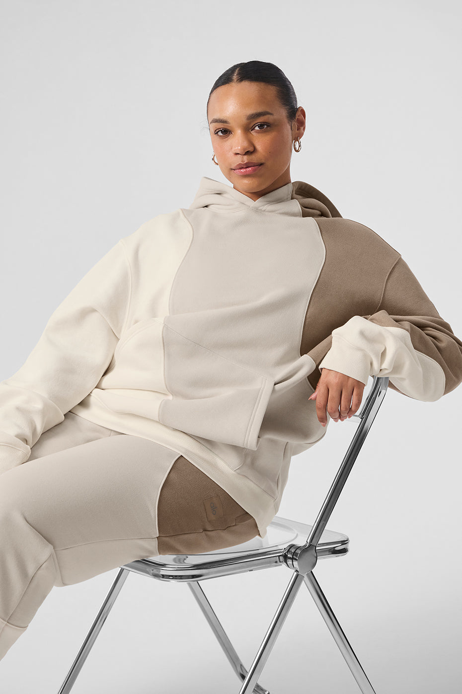 Close-up of the Wave Embrace oversized hoodie showcasing the seamed wave pattern.