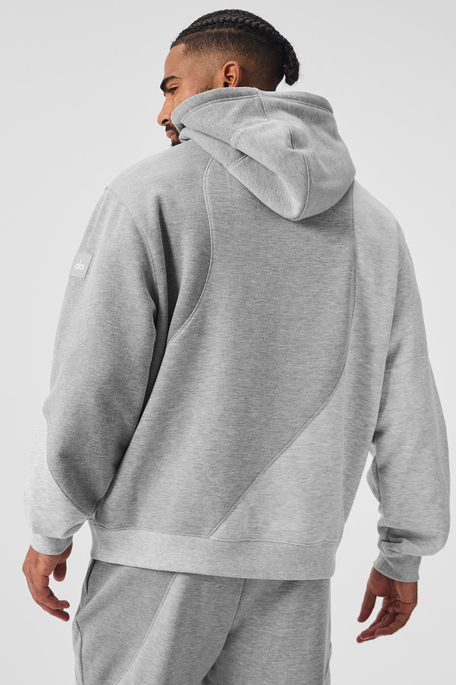 Close-up of the wave pattern detail on the Athletic Heather Grey hoodie.