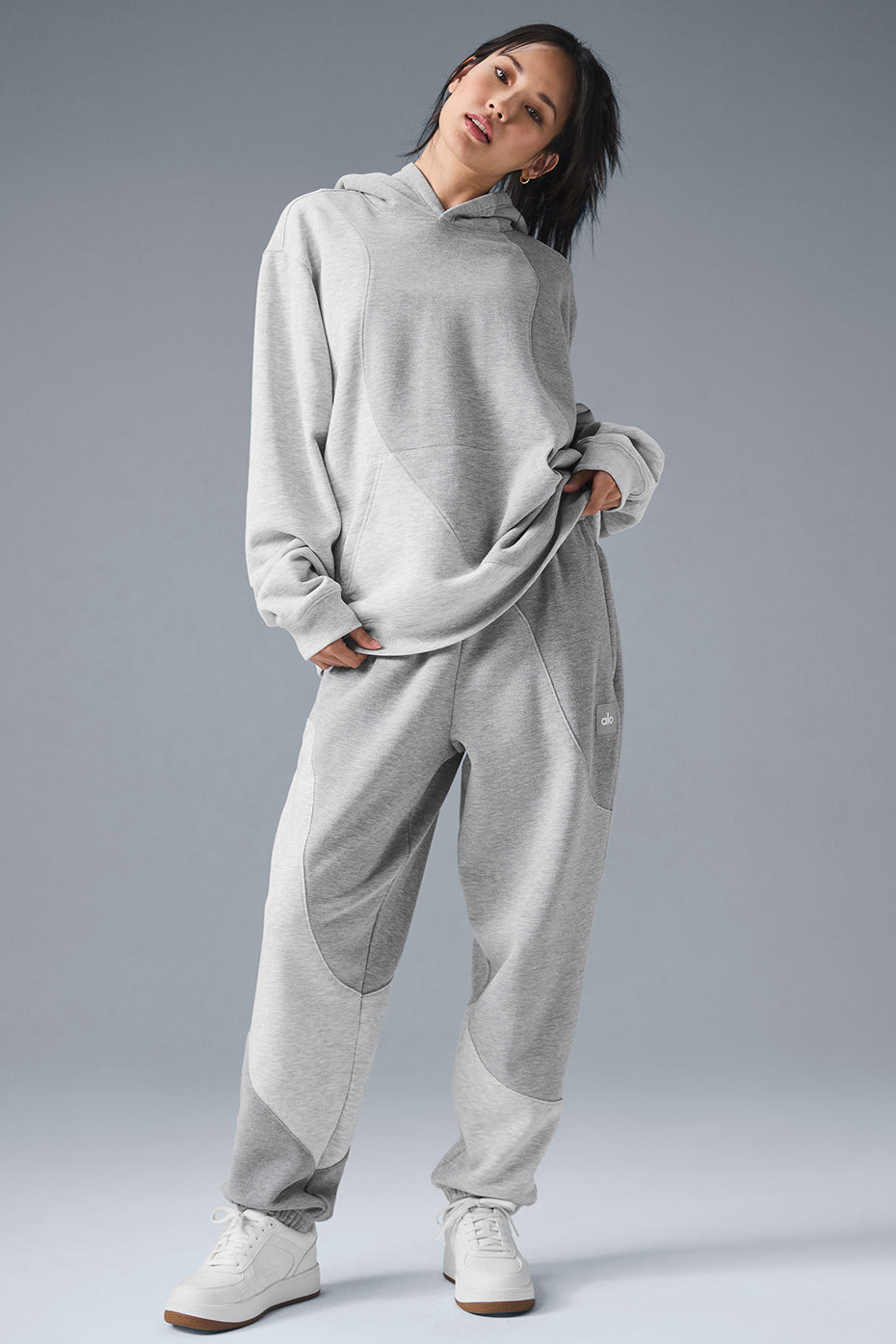 Front view of oversized french terry hoodie in Heather Grey with wave pattern detail