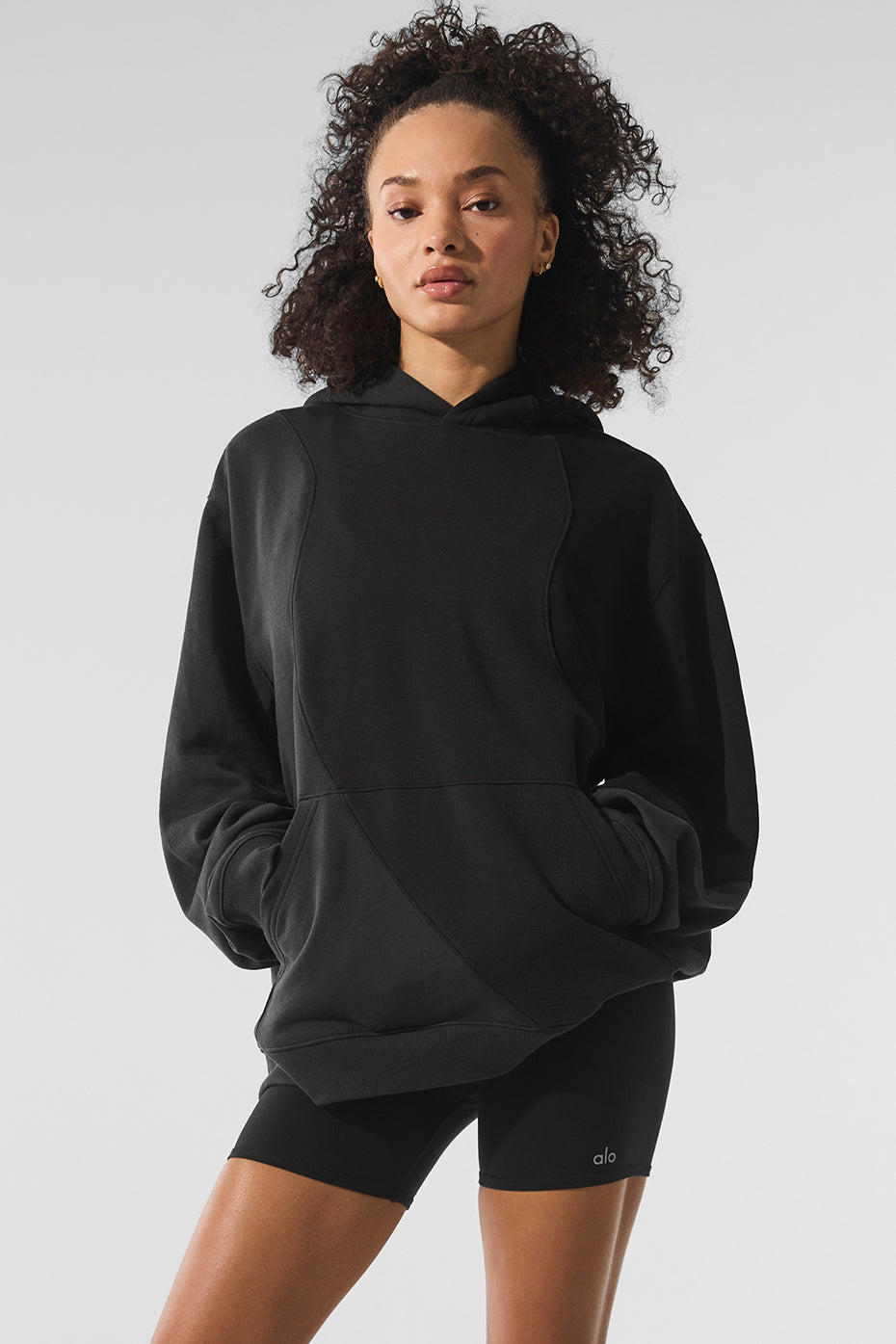 Front view of the vintage black hoodie showcasing its unique wave pattern.