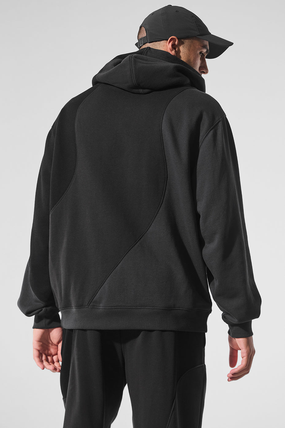 Detail shot of stitched wave texture across back of vintage black hoodie.