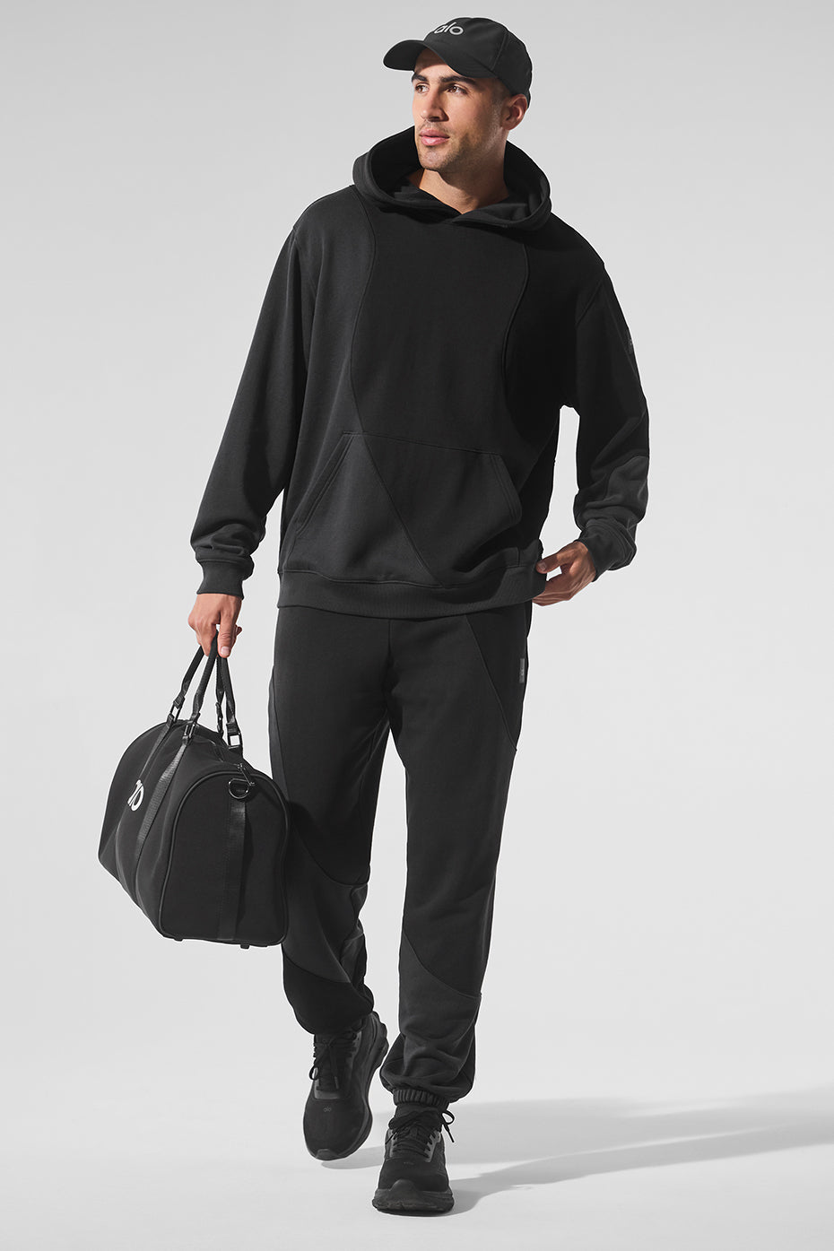 Side profile of model wearing parke sweatshirt-inspired hoodie on a crisp fall morning.