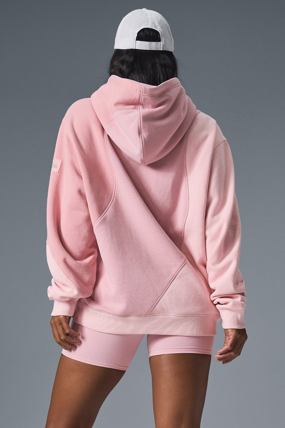Side view of the oversized hoodie showcasing the unique wave pattern.