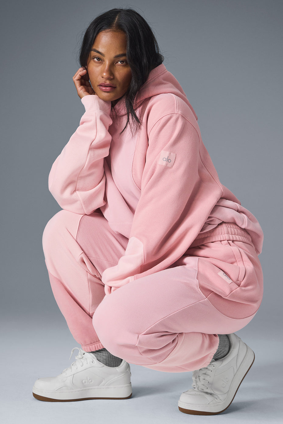 Front view of the Wavecrest Comfort Hoodie in sunset pink.