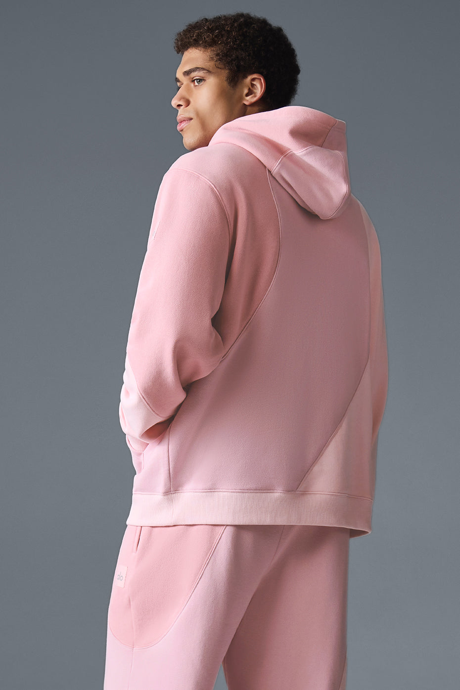 A model wearing the hoodie with matching sweatpants, ideal for athleisure.