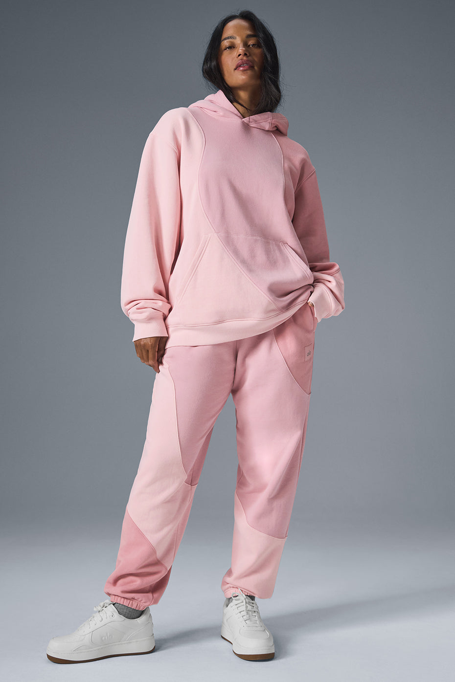 Front view of the Wavecrest Comfort Hoodie in sunset pink.