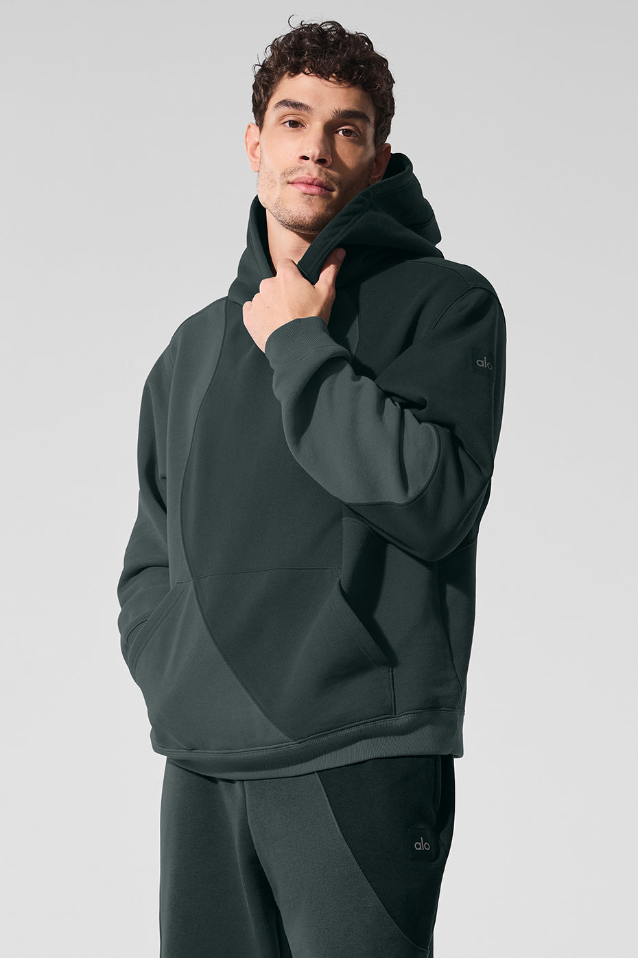 Model wearing the oversized hoodie, styled with matching sweatpants for a trendy look.