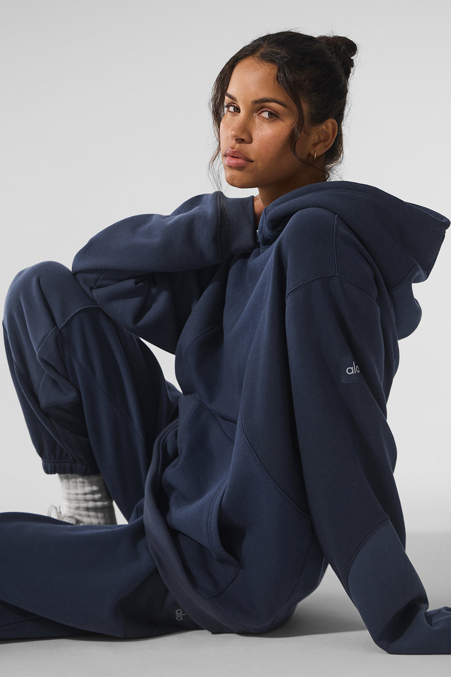 Close-up of navy oversized zip-up hoodie showing soft fabric texture