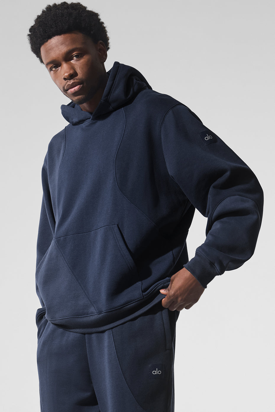 Close-up of French terry fabric texture on navy oversized hoodie