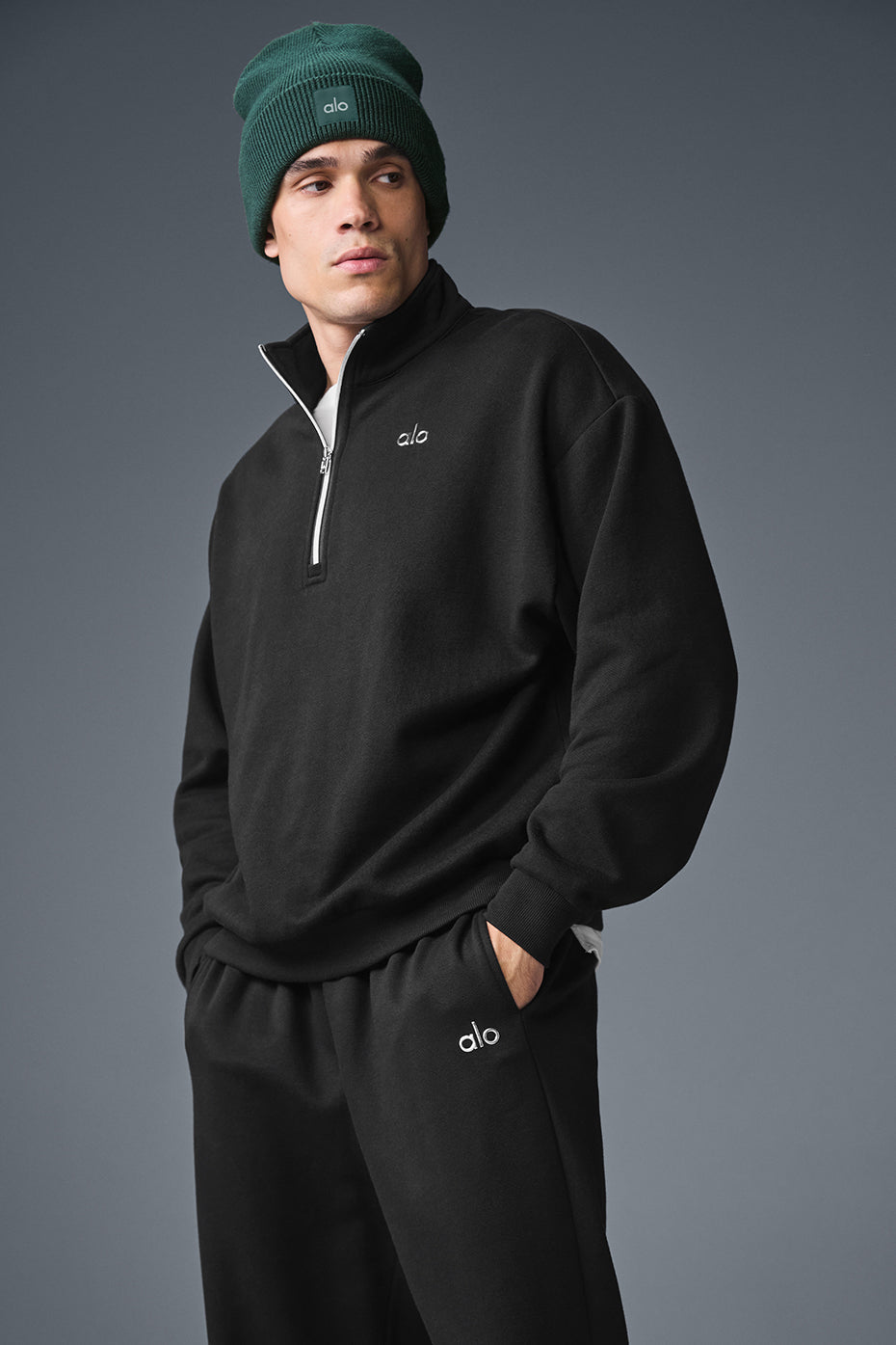 Accolade quarter-zip pullover in black from the front view.