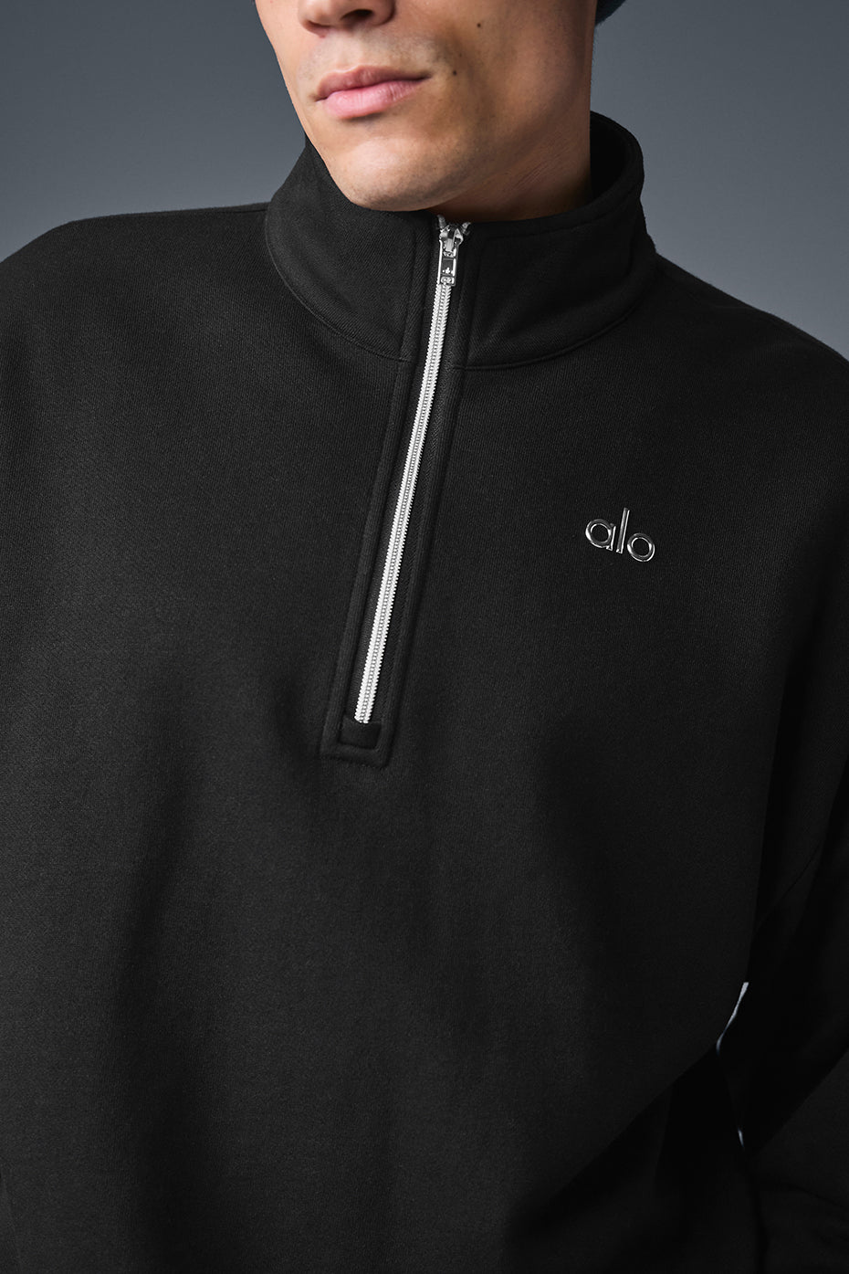 Accolade quarter-zip pullover in black from the front view.