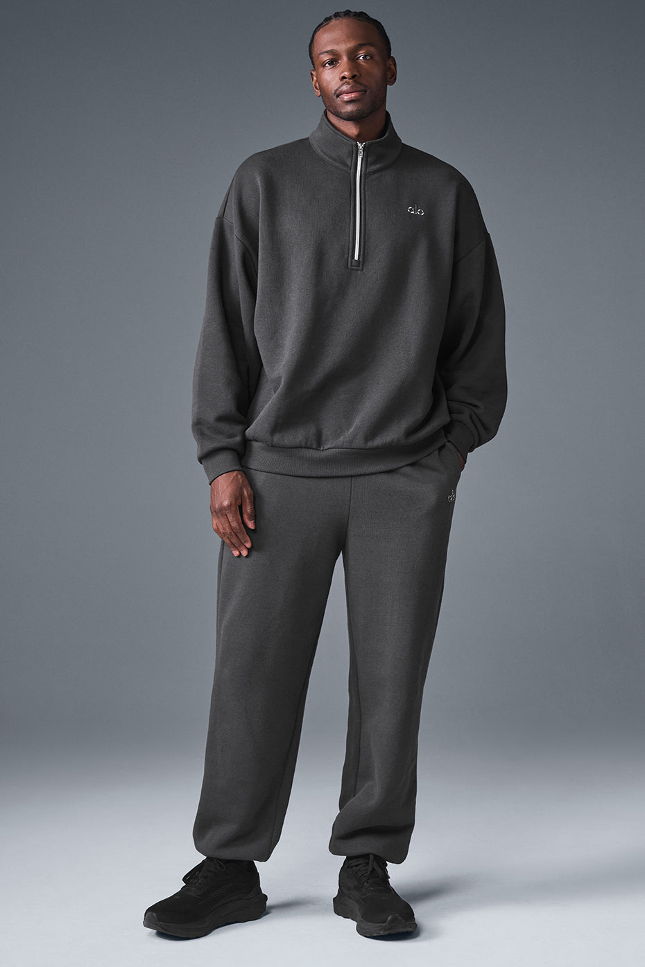 Model wearing the anthracite pullover in a relaxed setting, perfect for loungewear