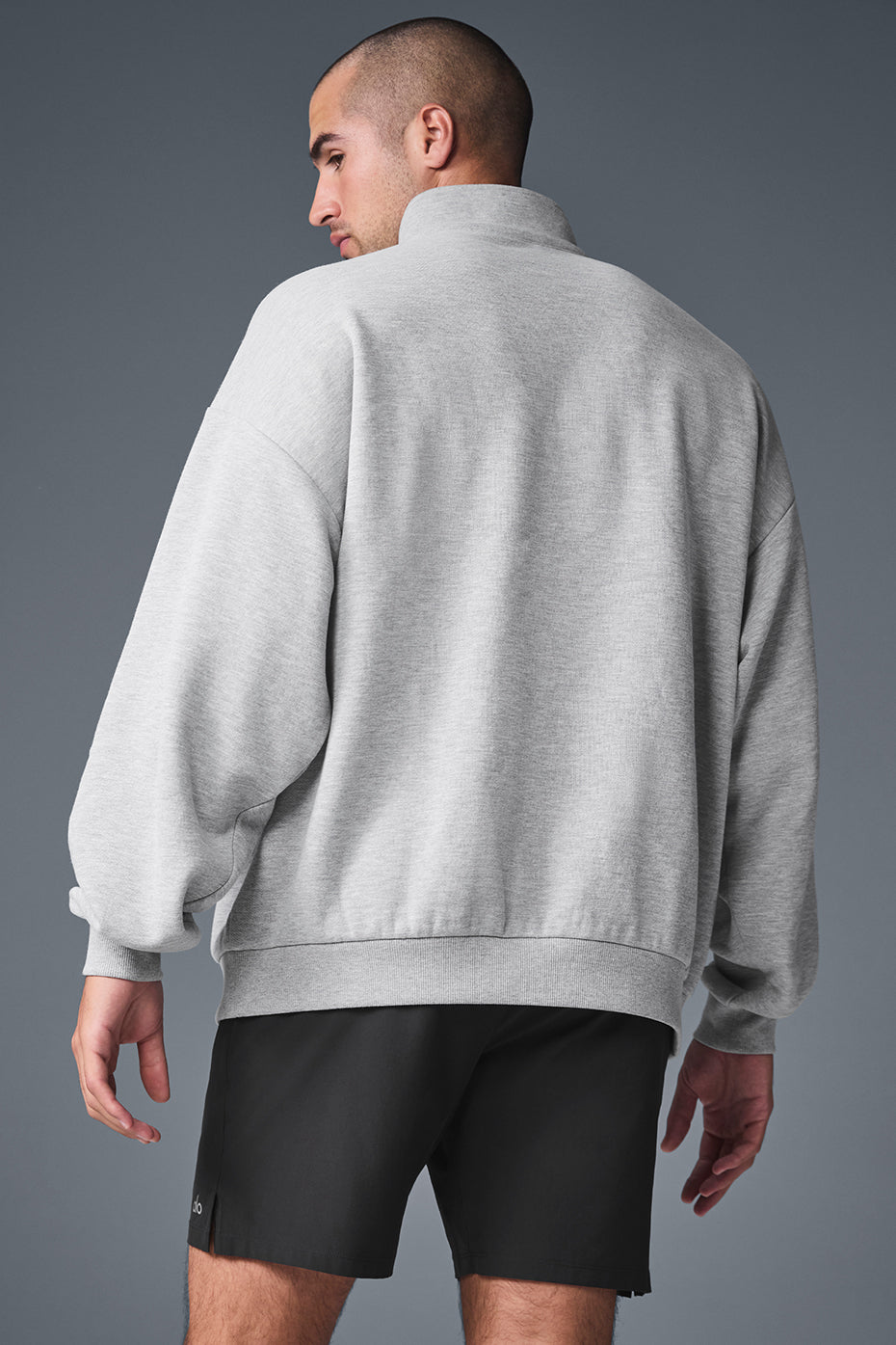 Lifestyle shot of the mens quarter zip pullover worn during a morning jog.