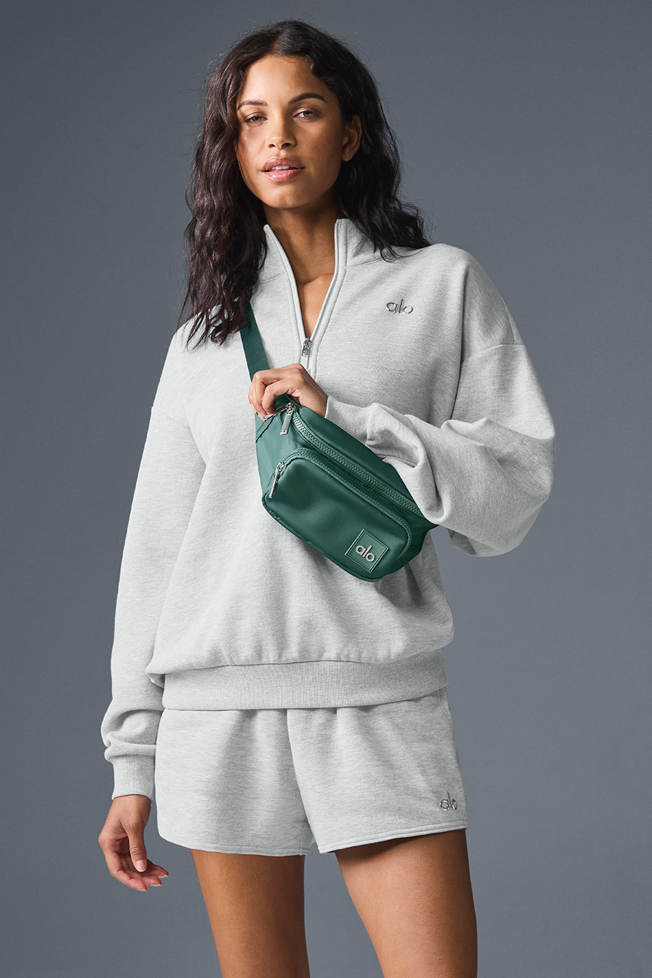 Detail of zip collar and fabric texture showing lightweight athletic wear appeal