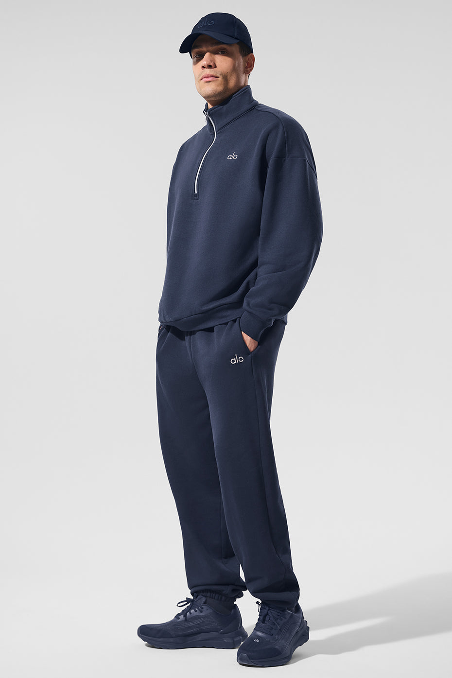 Mens navy quarter zip sweater with stand-up collar on a model for casual wear