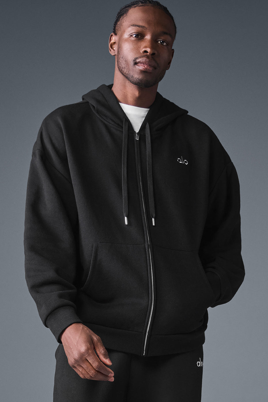 Front view of the oversized zip up hoodie in black, showcasing its relaxed fit.