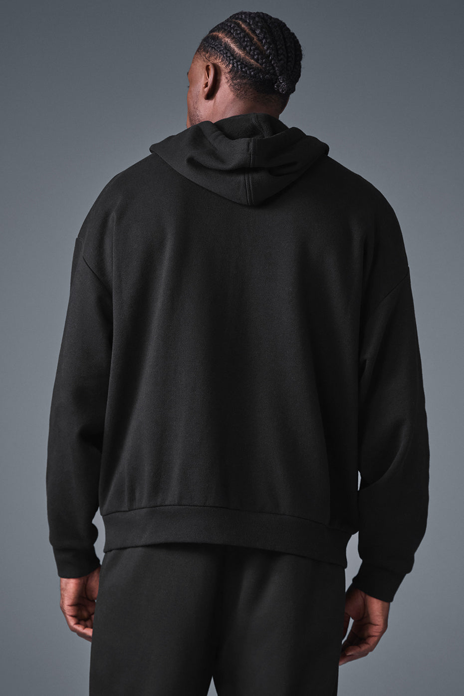 Back view of the full zip hoodie highlighting its stylish design and comfortable fit.