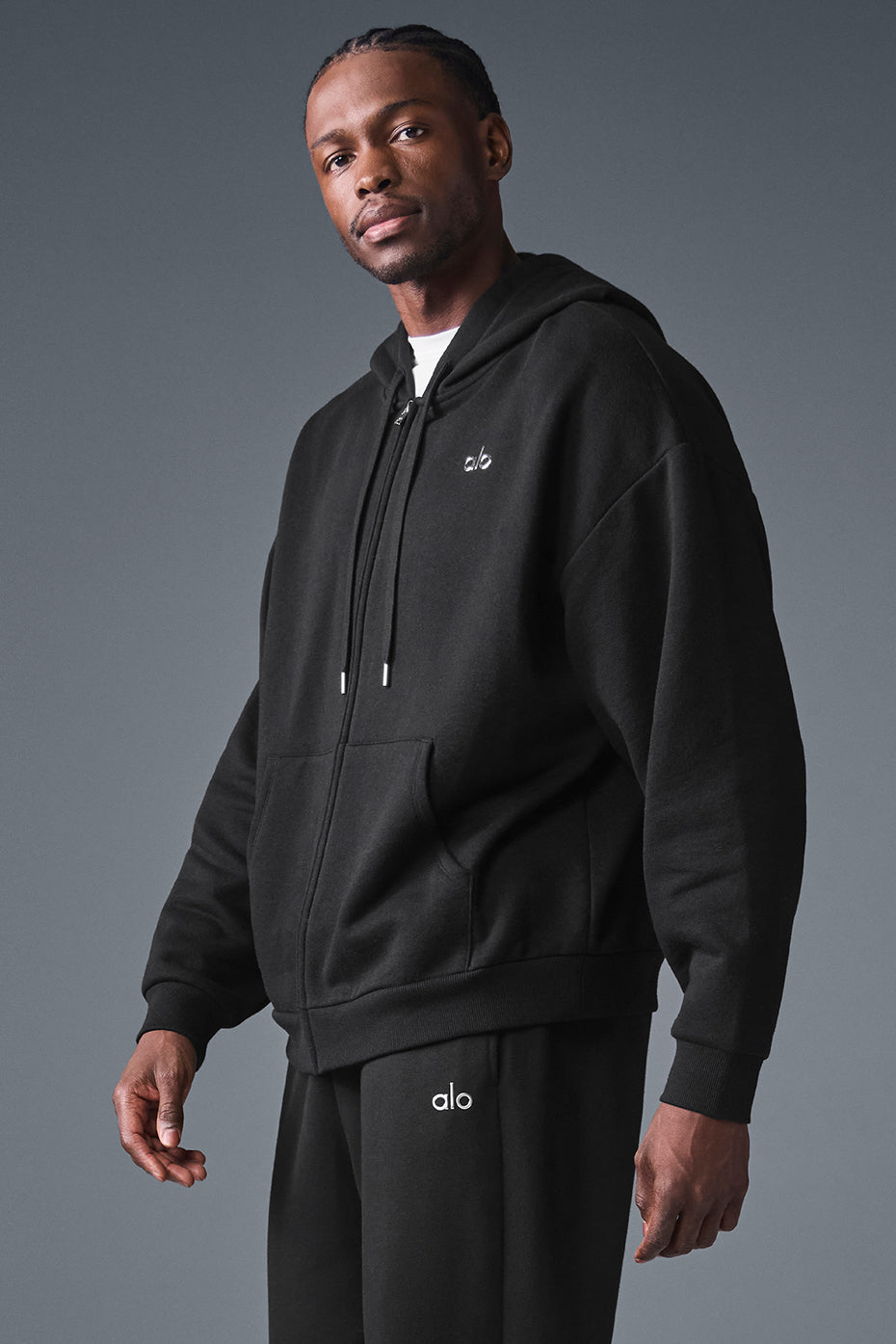 Front view of the oversized zip up hoodie in black, showcasing its relaxed fit.