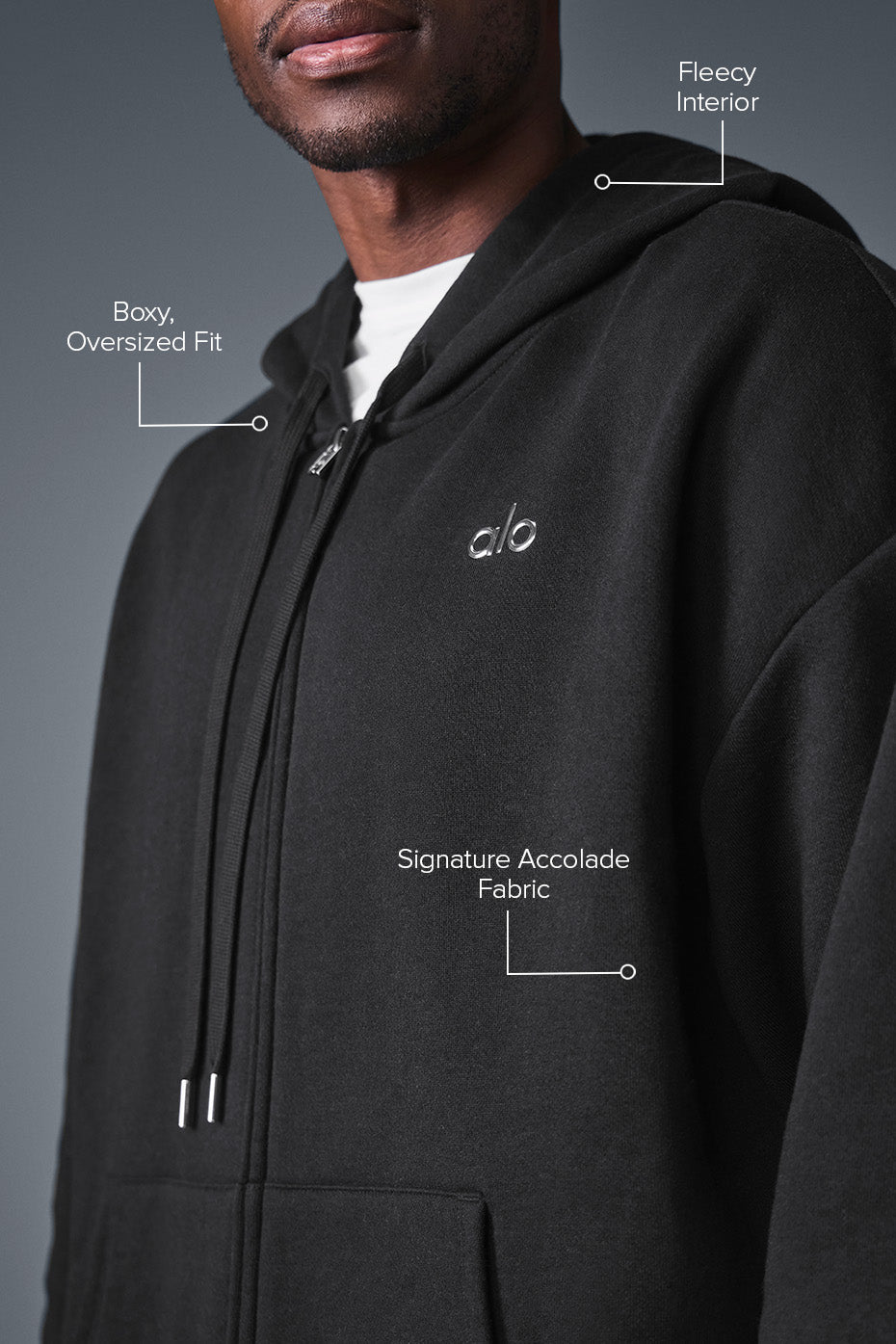Model wearing the black oversized hoodie, perfect for chilly urban outings.