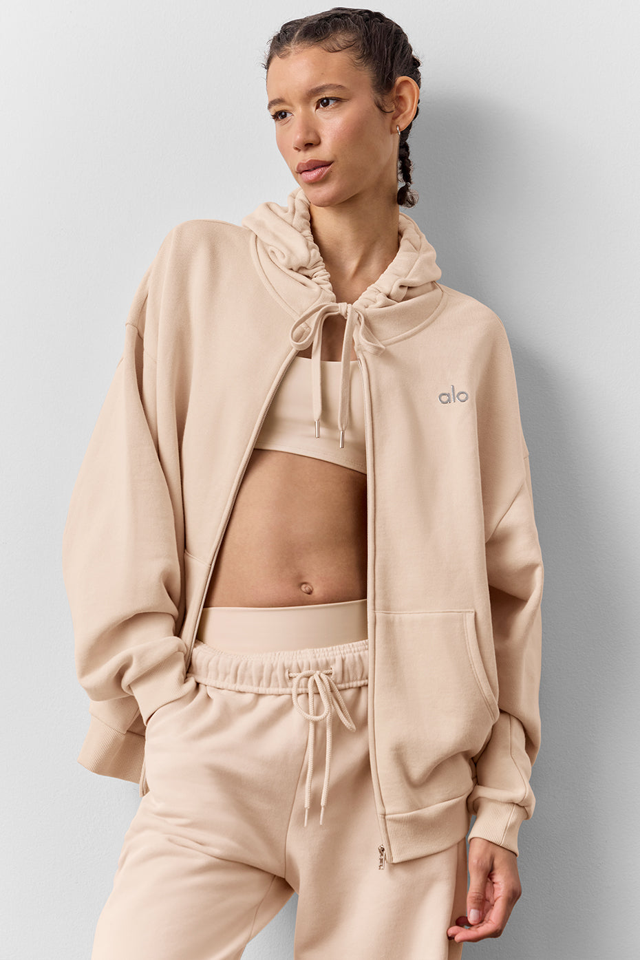 Casual styling of black zip up hoodie with oversized fit