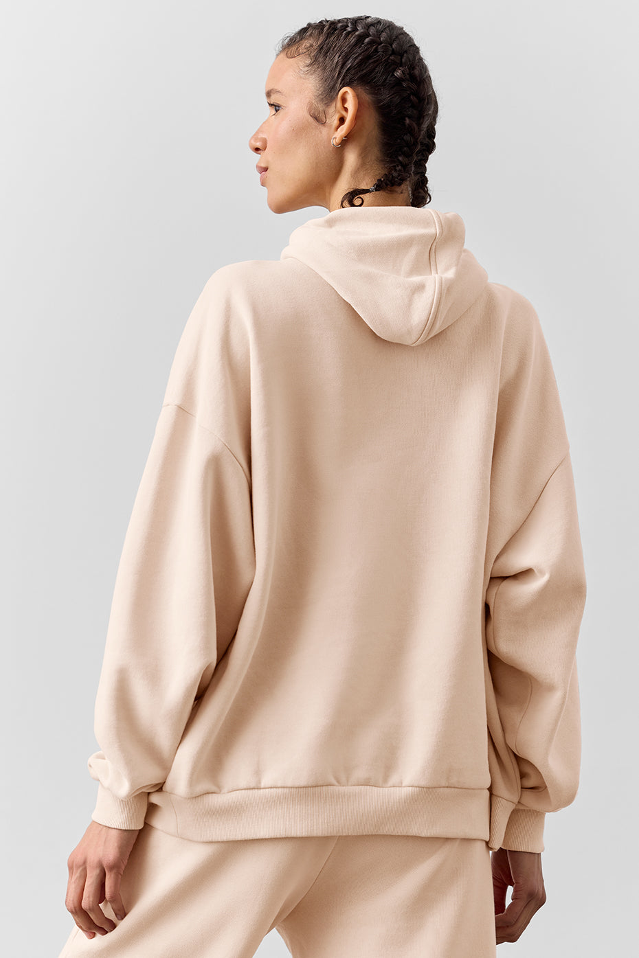 Model showcasing the full zip hoodie in macadamia