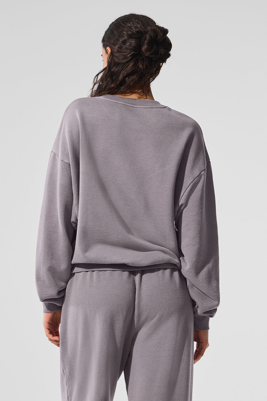 Side angle of the womens cotton sweater showcasing its relaxed fit.