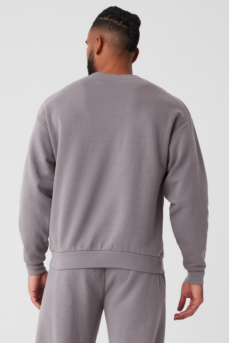 Model wearing the comfort colors hooded sweatshirt, styled with jeans for a casual look.