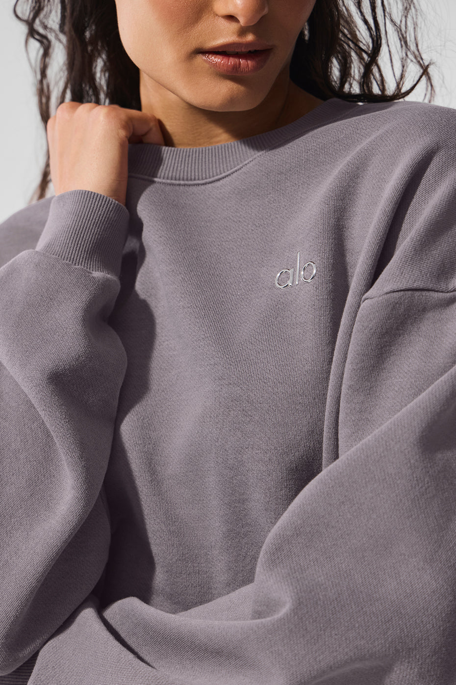 Model wearing the Accolade crew neck pullover with stylish loungewear.