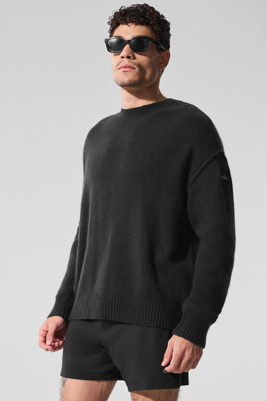 Close-up of the black cashmere crewneck sweater showcasing softness and texture.