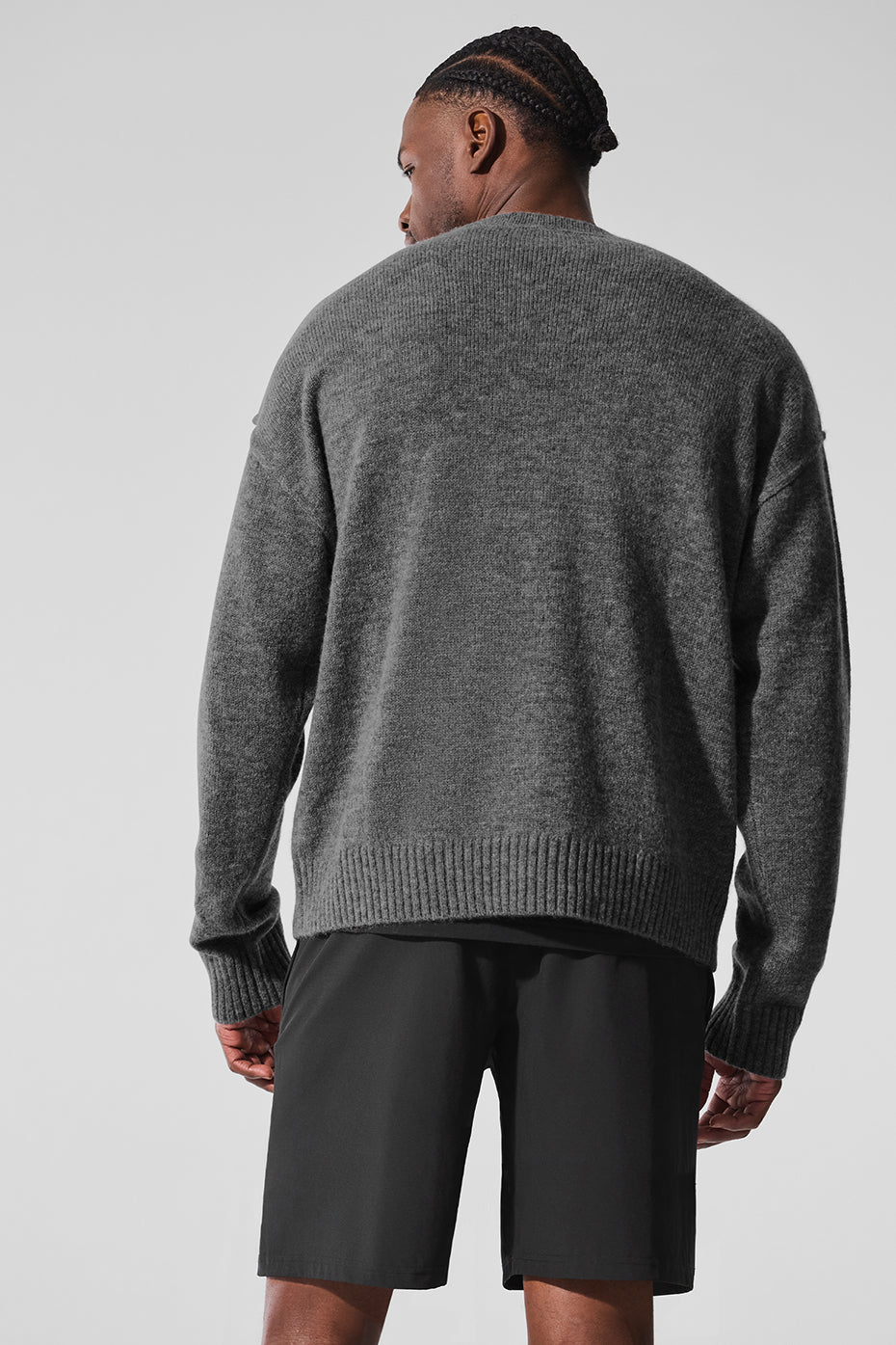 Relaxed fit of the cashmere cardigan sweater in a stylish setting.