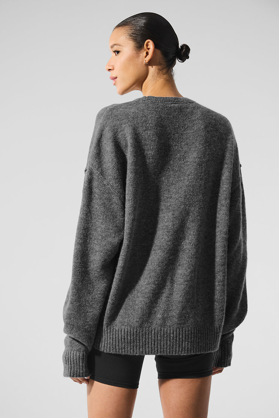 Detail of the soft fabric on a black crewneck sweater for men.
