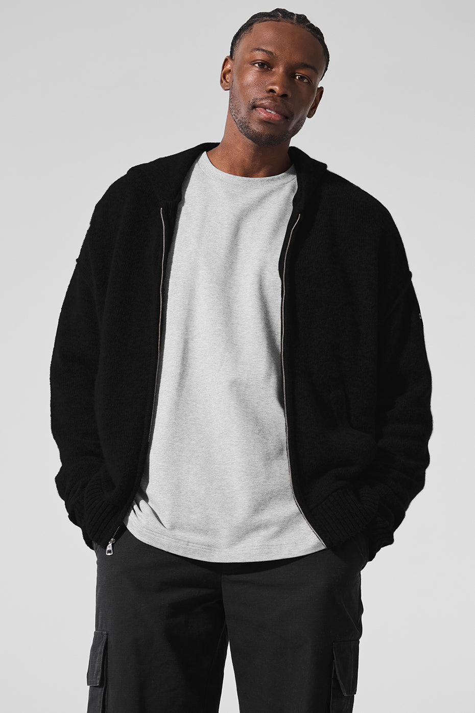 Cashmere full zip hoodie showcased on a model outdoors during a chilly evening.