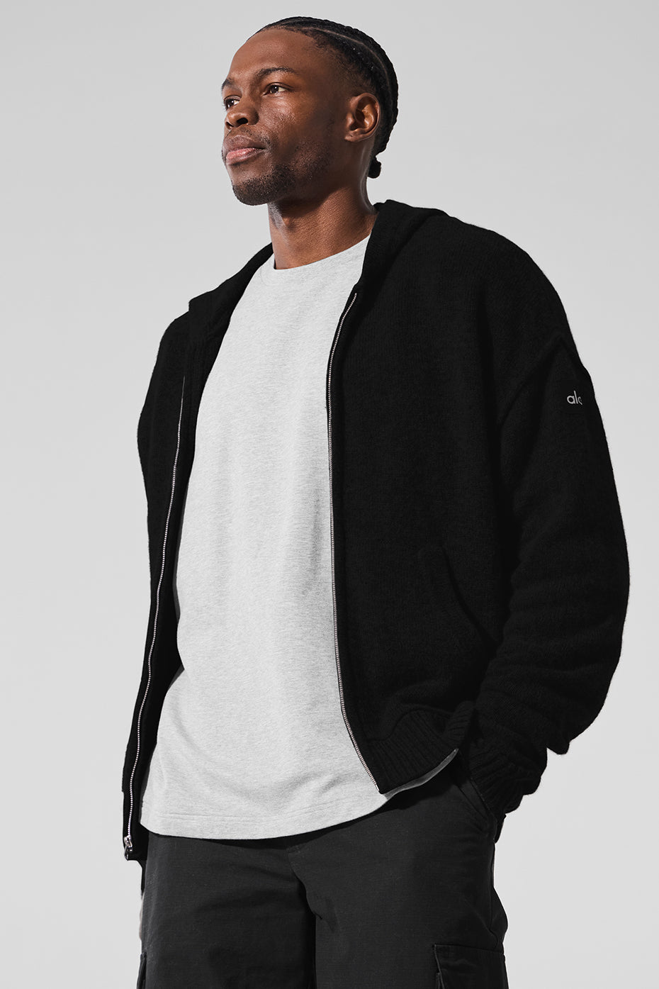 Unisex cashmere hoodie displayed on a hanger, emphasizing its relaxed fit.