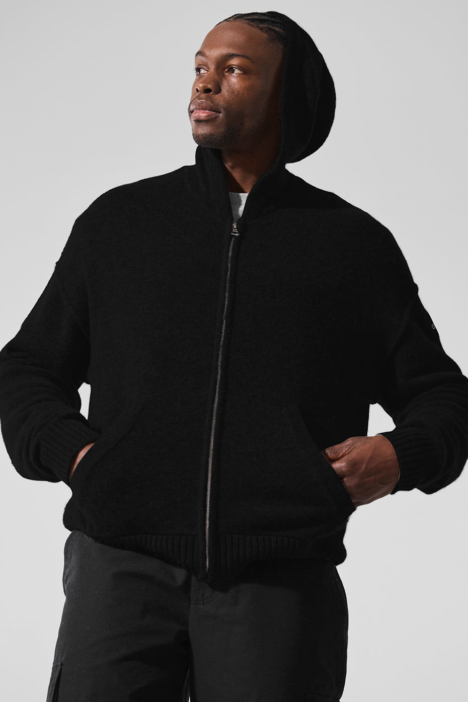 Cashmere full zip hoodie showcased on a model outdoors during a chilly evening.