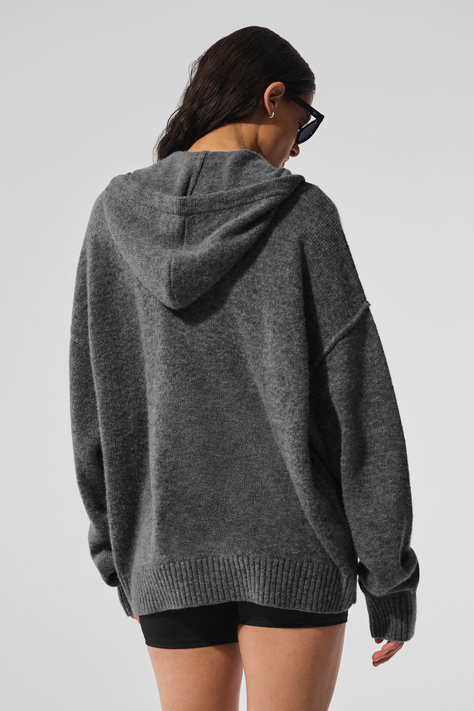 Relaxed fit of the cashmere hoodie showcased on a model
