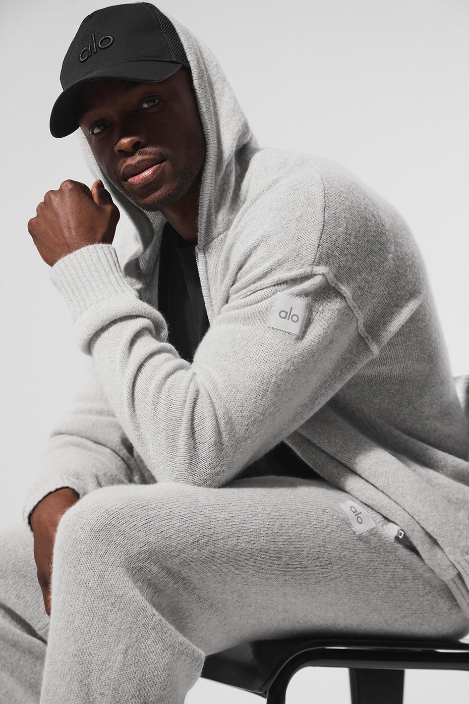 Relaxed fit cashmere hoodie displayed on a modern backdrop
