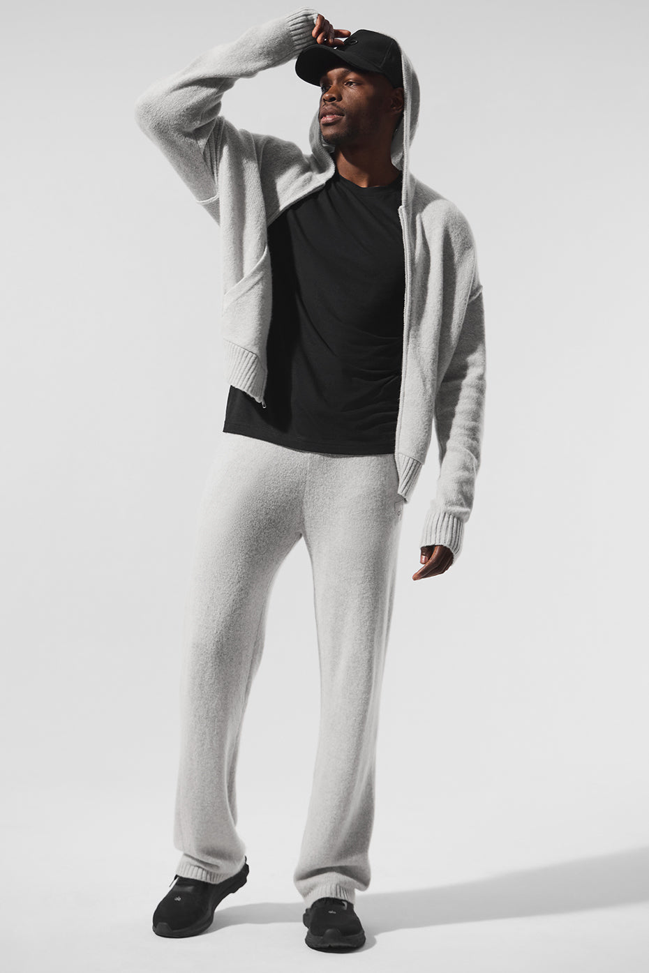 Relaxed fit cashmere hoodie displayed on a modern backdrop
